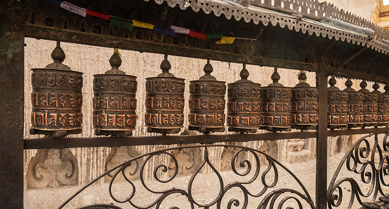 Rows of prayer wheel in Swayambhunath temple in Kathmandu city of Nepal.
